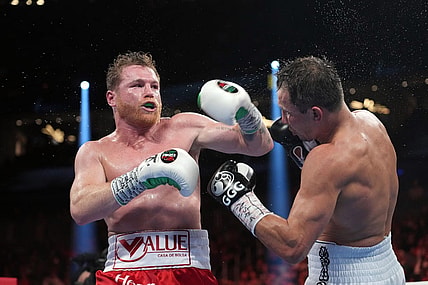 Sep 17, 2022; Las Vegas, Nevada, USA; Canelo Alvarez (red trunks) and Gennadiy Golovkin (white trunks) box during their super middleweight championship boxing bout at T-Mobile Arena. Mandatory Credit: Joe Camporeale-USA TODAY Sports