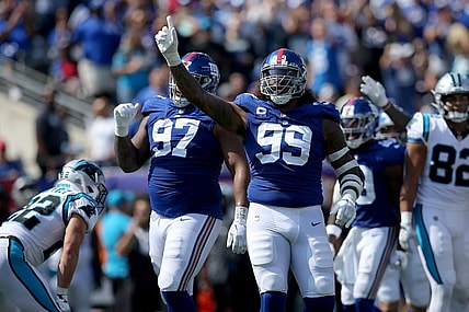 Sep 18, 2022; East Rutherford, New Jersey, USA; New York Giants defensive end Leonard Williams (99) and defensive tackle Dexter Lawrence (97) celebrate after Carolina Panthers turn the ball over on downs during the second quarter at MetLife Stadium. Mandatory Credit: Brad Penner-USA TODAY Sports