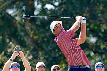 Sep 20, 2022; Charlotte, North Carolina, USA; Team USA golfer Scottie Scheffler plays his shot from the 15th tee during a practice day for the Presidents Cup golf tournament at Quail Hollow Club. Mandatory Credit: Peter Casey-USA TODAY Sports
