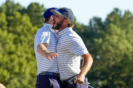 Sep 23, 2022; Charlotte, North Carolina, USA; Team USA golfer Max Homa celebrates on the 18th green during the four-ball match play of the Presidents Cup golf tournament at Quail Hollow Club. Mandatory Credit: Jim Dedmon-USA TODAY Sports