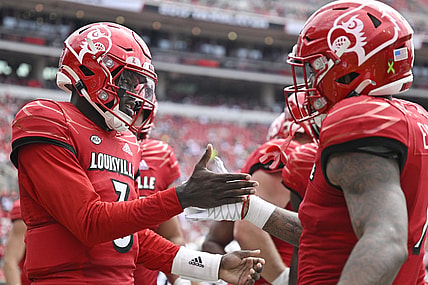 Sep 24, 2022; Louisville, Kentucky, USA; Louisville Cardinals quarterback Malik Cunningham (3) celebrates a touchdown with teammates during the second quarter against the South Florida Bulls at Cardinal Stadium. Mandatory Credit: Jamie Rhodes-USA TODAY Sports