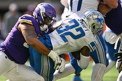 Sep 25, 2022; Minneapolis, Minnesota, USA; Detroit Lions running back D'Andre Swift (32) is tackled by Minnesota Vikings defensive end Jonathan Bullard (93) during the fourth quarter at U.S. Bank Stadium. Mandatory Credit: Jeffrey Becker-USA TODAY Sports