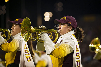 A member of the Arizona State University marching band plays a trumpet during a halftime show at Sun Devil Stadium in Tempe on Oct. 8, 2021. Monica D. Spencer/The Republic 6029647001

Asu Stanford Football Game 6029647001 10