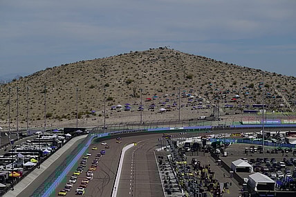 Mar 13, 2022; Avondale, Arizona, USA; General view as NASCAR Cup Series driver Kyle Busch (18) and driver Ryan Blaney (12) lead the field for the restart of the Ruoff Mortgage 500 at Phoenix Raceway. Mandatory Credit: Gary A. Vasquez-USA TODAY Sports