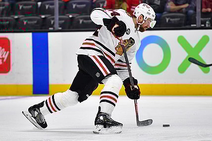 Mar 23, 2022; Anaheim, California, USA; Chicago Blackhawks defenseman Calvin de Haan (44) shoots on goal against the Anaheim Ducks during the first period at Honda Center. Mandatory Credit: Gary A. Vasquez-USA TODAY Sports