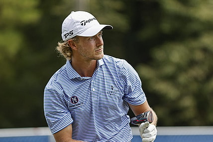 Aug 4, 2022; Greensboro, North Carolina, USA; Austin Smotherman watches his tee shot on the 18th tee during the first round of the Wyndham Championship golf tournament. Mandatory Credit: Nell Redmond-USA TODAY Sports