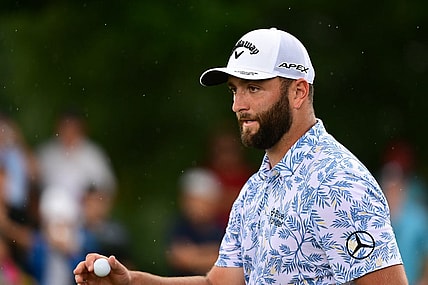 Aug 25, 2022; Atlanta, Georgia, USA; Jon Rahm waves to the gallery after a putt on the 1st green during the first round of the TOUR Championship golf tournament. Mandatory Credit: Adam Hagy-USA TODAY Sports