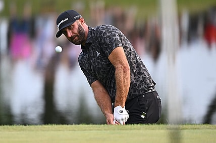 Sep 17, 2022; Chicago, Illinois, USA; Dustin Johnson chips onto the 17th green during the second round of the Invitational Chicago LIV Golf tournament at Rich Harvest Farms. Mandatory Credit: Jamie Sabau-USA TODAY Sports