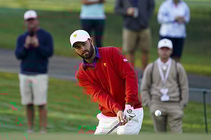 Sep 24, 2022; Charlotte, North Carolina, USA; Team USA golfer Cameron Young hits a chip shot on the third green during the foursomes match play of the Presidents Cup golf tournament at Quail Hollow Club. Mandatory Credit: Peter Casey-USA TODAY Sports