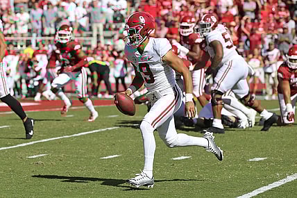 Oct 1, 2022; Fayetteville, Arkansas, USA; Alabama Crimson Tide quarterback Bryce Young (9) rushes for a touchdown in the first quarter against the Arkansas Razorbacks at Donald W. Reynolds Razorback Stadium. Mandatory Credit: Nelson Chenault-USA TODAY Sports