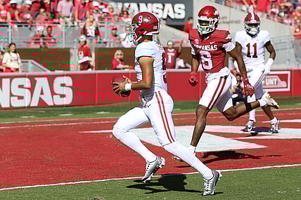 Oct 1, 2022; Fayetteville, Arkansas, USA; Alabama Crimson Tide quarterback Bryce Young (9) rushes for a touchdown in the first quarter against the Arkansas Razorbacks at Donald W. Reynolds Razorback Stadium. Mandatory Credit: Nelson Chenault-USA TODAY Sports