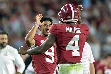 Oct 8, 2022; Tuscaloosa, Alabama, USA; Alabama Crimson Tide quarterback Jalen Milroe (4) celebrates with quarterback Bryce Young (9) after scoring a touchdown against the Texas A&M Aggies during the first half at Bryant-Denny Stadium. Mandatory Credit: Marvin Gentry-USA TODAY Sports