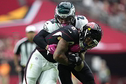 Oct 9, 2022; Glendale, Arizona, USA; Philadelphia Eagles safety Marcus Epps (22) tackles Arizona Cardinals running back James Conner (6) during the first half at State Farm Stadium. Mandatory Credit: Joe Camporeale-USA TODAY Sports