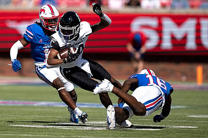 Cincinnati Bearcats wide receiver Jadon Thompson (20) is tackled by Southern Methodist Mustangs safety Ahmaad Moses (16) in the second quarter of the American Athletic Conference game between the Cincinnati Bearcats and the Southern Methodist Mustangs at Gerald J. Ford Stadium in Dallas on Saturday, Oct. 22, 2022.

Cincinnati Bearcats At Southern Methodist Mustangs 463