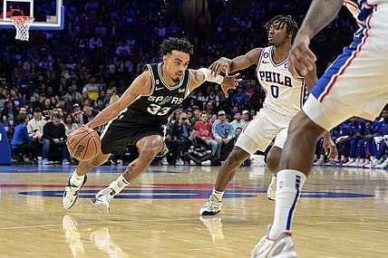 Oct 22, 2022; Philadelphia, Pennsylvania, USA;  San Antonio Spurs guard Tre Jones (33) moves to the net as Philadelphia 76ers guard Tyrese Maxey (0) defends during the first quarter of the game at Wells Fargo Center. Mandatory Credit: John Geliebter-USA TODAY Sports