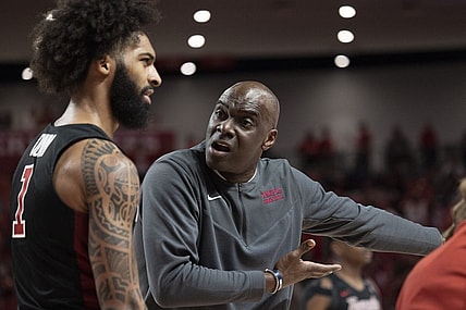Mar 3, 2022; Houston, Texas, USA; Temple Owls head coach Aaron McKie talks to guard Damian Dunn (1) during a Houston Cougars time-out  in the first half at Fertitta Center. Mandatory Credit: Thomas Shea-USA TODAY Sports