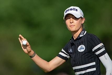 Aug 27, 2022; Ottawa, Ontario, CAN; Nelly Korda finishes up the 18th hole during the third round of the CP Women's Open golf tournament. Mandatory Credit: Marc DesRosiers-USA TODAY Sports