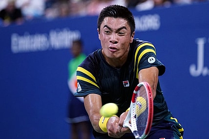 Sep 3, 2022; Flushing, NY, USA; Brandon Nakashima of the United States hits to Jannik Sinner of Italy on day six of the 2022 U.S. Open tennis tournament at USTA Billie Jean King Tennis Center. Mandatory Credit: Danielle Parhizkaran-USA TODAY Sports