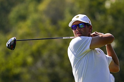 Sep 24, 2022; Charlotte, North Carolina, USA; International Team golfer Adam Scott hits his tee shot on the eighth hole during the four-ball match play of the Presidents Cup golf tournament at Quail Hollow Club. Mandatory Credit: Peter Casey-USA TODAY Sports