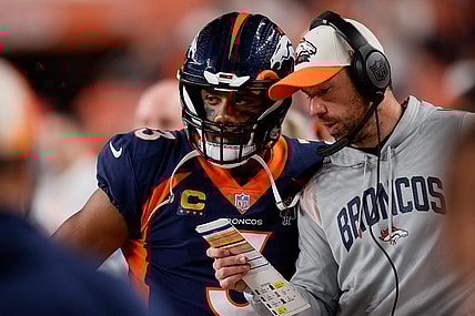 Sep 25, 2022; Denver, Colorado, USA; Denver Broncos quarterback Russell Wilson (3) talks with quarterbacks coach Klint Kubiak in the second quarter against the San Francisco 49ers at Empower Field at Mile High. Mandatory Credit: Isaiah J. Downing-USA TODAY Sports