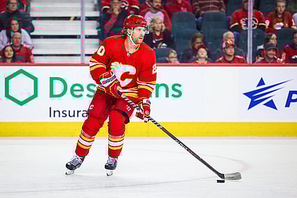 Oct 22, 2022; Calgary, Alberta, CAN; Calgary Flames center Blake Coleman (20) controls the puck against the Carolina Hurricanes during the first period at Scotiabank Saddledome. Mandatory Credit: Sergei Belski-USA TODAY Sports