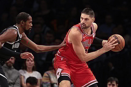 Nov 1, 2022; Brooklyn, New York, USA; Chicago Bulls center Nikola Vucevic (9) shields the ball from Brooklyn Nets forward Kevin Durant (7) during the first half at Barclays Center. Mandatory Credit: Vincent Carchietta-USA TODAY Sports