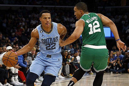 Nov 7, 2022; Memphis, Tennessee, USA; Memphis Grizzlies guard Desmond Bane (22) dribbles around Boston Celtics forward Grant Williams (12) during the first half at FedExForum. Mandatory Credit: Petre Thomas-USA TODAY Sports