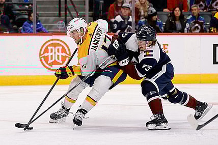 Nov 10, 2022; Denver, Colorado, USA; Nashville Predators center Mark Jankowski (17) controls the puck under pressure from h75 in the third period at Ball Arena. Mandatory Credit: Isaiah J. Downing-USA TODAY Sports