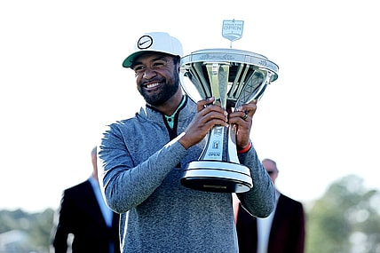 Nov 13, 2022; Houston, Texas, USA; Tony Finau raises the championship trophy after winning the Cadence Bank Houston Open golf tournament. Mandatory Credit: Erik Williams-USA TODAY Sports