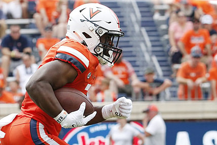 Sep 3, 2022; Charlottesville, Virginia, USA; Virginia Cavaliers running back Mike Hollins (7) carries the ball during the first half against the Richmond Spiders at Scott Stadium. Mandatory Credit: Amber Searls-USA TODAY Sports