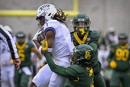 Nov 19, 2022; Waco, Texas, USA; TCU Horned Frogs wide receiver Quentin Johnston (1) catches a pass for a first down against the Baylor Bears as cornerback Mark Milton (3) defends during the first quarter at McLane Stadium. Mandatory Credit: Jerome Miron-USA TODAY Sports