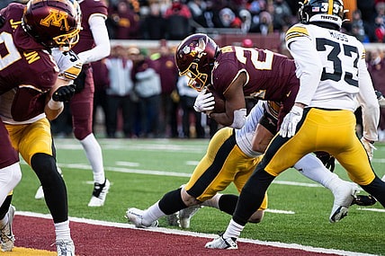 Nov 19, 2022; Minneapolis, Minnesota, USA; Minnesota Golden Gophers running back Mohamed Ibrahim (24) runs for a touchdown against the Iowa Hawkeyes during the second quarter at Huntington Bank Stadium. Mandatory Credit: Matt Krohn-USA TODAY Sports