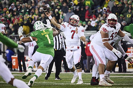 Nov 19, 2022; Eugene, Oregon, USA; Utah Utes quarterback Cameron Rising (7) throws a pass during the first half against Oregon Ducks linebacker Noah Sewell (1) at Autzen Stadium. Mandatory Credit: Troy Wayrynen-USA TODAY Sports