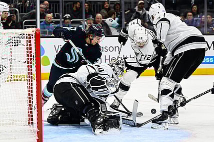 Nov 19, 2022; Seattle, Washington, USA; Los Angeles Kings goaltender Cal Petersen (40) defends the goal as Seattle Kraken center Jaden Schwartz (17) and Los Angeles Kings left wing Trevor Moore (12) fight for the puck during the third period at Climate Pledge Arena.  Seattle won 3-2. Mandatory Credit: Steven Bisig-USA TODAY Sports