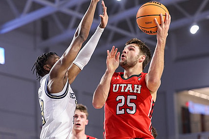 Nov 21, 2022; Fort Myers, Florida, USA;  Utah Utes guard Rollie Worster (25) drives to the basket, defended by Georgia Tech Yellow Jackets guard Miles Kelly (13) in the first half during the Fort Myers Tip-off at Suncoast Credit Union Arena. Mandatory Credit: Nathan Ray Seebeck-USA TODAY Sports