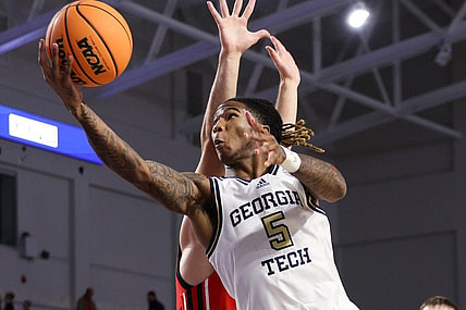 Nov 21, 2022; Fort Myers, Florida, USA;  Georgia Tech Yellow Jackets guard Deivon Smith (5) drives to the basket defended by Utah Utes guard Lazar Stefanovic (20) in the second half during the Fort Myers Tip-off at Suncoast Credit Union Arena. Mandatory Credit: Nathan Ray Seebeck-USA TODAY Sports