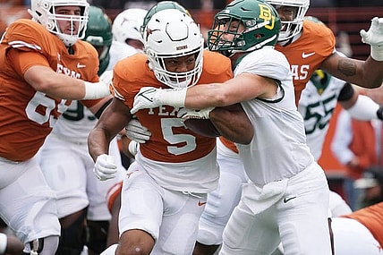 Texas Longhorns running back Bijan Robinson (5) runs the ball forward during the Texas Longhorns game against Baylor on Friday, Nov. 25, 2022.

Ut Baylor Football 00323