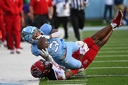 Nov 25, 2022; Chapel Hill, North Carolina, USA; North Carolina Tar Heels wide receiver Antoine Green (3) attempts to catch the ball as North Carolina State Wolfpack cornerback Aydan White (3) defends in the first quarter at Kenan Memorial Stadium. Mandatory Credit: Bob Donnan-USA TODAY Sports