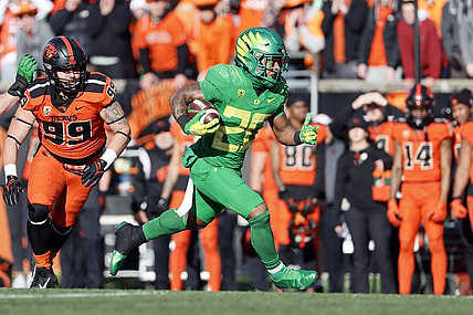 Nov 26, 2022; Corvallis, Oregon, USA; Oregon Ducks running back Jordan James (20) runs with the ball during the first half against the Oregon State Beavers at Reser Stadium. Mandatory Credit: Soobum Im-USA TODAY Sports