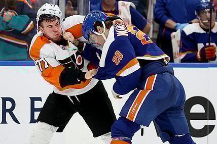 Nov 26, 2022; Elmont, New York, USA; Philadelphia Flyers defenseman Tony DeAngelo (77) fights New York Islanders right wing Oliver Wahlstrom (26) during the third period at UBS Arena. Mandatory Credit: Brad Penner-USA TODAY Sports