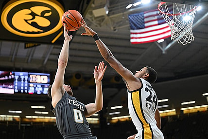 Nov 29, 2022; Iowa City, Iowa, USA; Iowa Hawkeyes forward Kris Murray (24) blocks the shot of Georgia Tech Yellow Jackets guard Lance Terry (0) during the first half at Carver-Hawkeye Arena. Mandatory Credit: Jeffrey Becker-USA TODAY Sports