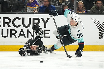 Nov 29, 2022; Los Angeles, California, USA; Seattle Kraken left wing Andre Burakovsky (95) collides with LA Kings defenseman Drew Doughty (8) in the third period at Crypto.com Arena. Mandatory Credit: Kirby Lee-USA TODAY Sports
