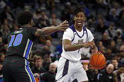 Jan 27, 2022; Memphis, Tennessee, USA; East Carolina Pirates guard Javon Small (1) dribbles as Memphis Tigers guard Alex Lomax (10) defends during the second half at FedExForum. Mandatory Credit: Petre Thomas-USA TODAY Sports