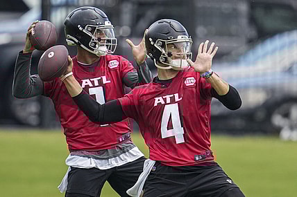 Jun 14, 2022; Flowery Branch, GA, USA; Atlanta Falcons quarterbacks Desmond Ridder (4) and Marcus Mariota (1) pass on the field during Minicamp at the Falcons Training Complex. Mandatory Credit: Dale Zanine-USA TODAY Sports