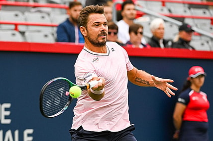 Aug 8, 2022; Montreal, Quebec, Canada; Stan Wawrinka (SUI) hits a shot against Emil Ruusuvuori (FIN) (not pictured) during first round play at IGA Stadium. Mandatory Credit: David Kirouac-USA TODAY Sports