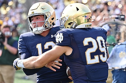 Sep 10, 2022; South Bend, Indiana, USA; Notre Dame Fighting Irish quarterback Tyler Buchner (12) celebrates with wide receiver Matt Salerno (29) after running for a two point conversation in the fourth quarter against the Marshall Thundering Herd at Notre Dame Stadium. Mandatory Credit: Matt Cashore-USA TODAY Sports