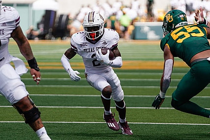 Sep 17, 2022; Waco, Texas, USA;  Texas State Bobcats wide receiver Ashtyn Hawkins (2) runs against Baylor Bears linebacker Garmon Randolph (55) during the first half at McLane Stadium. Mandatory Credit: Chris Jones-USA TODAY Sports