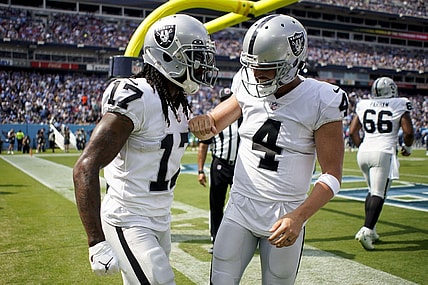 Sep 25, 2022; Nashville, Tennessee, USA; Las Vegas Raiders wide receiver Davante Adams (17) celebrates his touchdown against the Tennessee Titans with quarterback Derek Carr (4) during the second quarter at Nissan Stadium. Mandatory Credit: Andrew Nelles-USA TODAY Sports