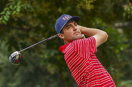 Sep 25, 2022; Charlotte, North Carolina, USA; Team USA golfer Scottie Scheffler hits his tee shot on the 17th hole during the singles match play of the Presidents Cup golf tournament at Quail Hollow Club. Mandatory Credit: Peter Casey-USA TODAY Sports