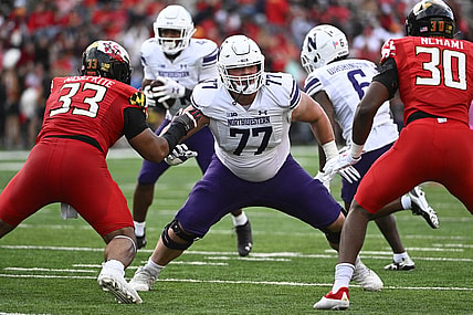 Oct 22, 2022; College Park, Maryland, USA; Northwestern Wildcats offensive lineman Peter Skoronski (77) prepares to block against the Maryland Terrapins at SECU Stadium. Mandatory Credit: Brad Mills-USA TODAY Sports